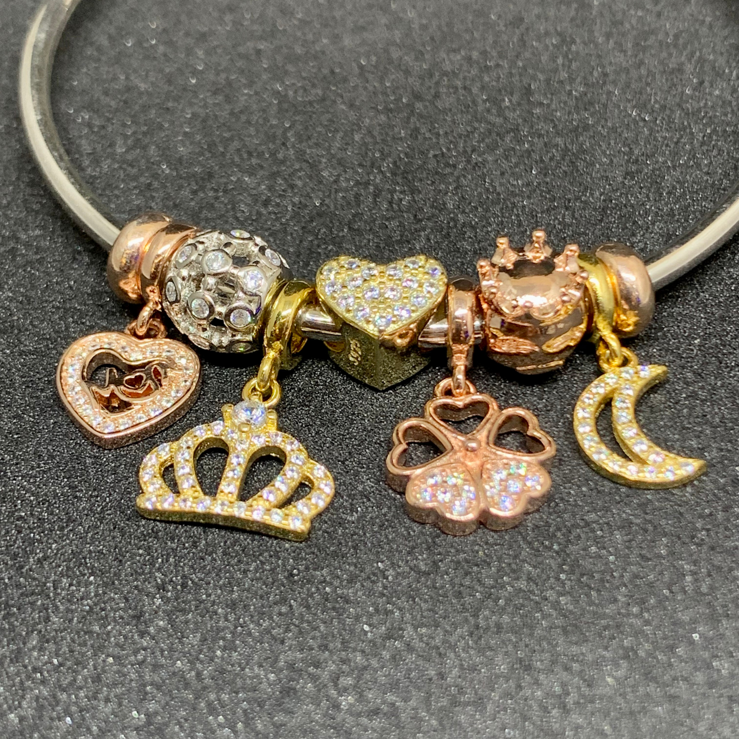 Pandora bangle with crown, heart, moon charms