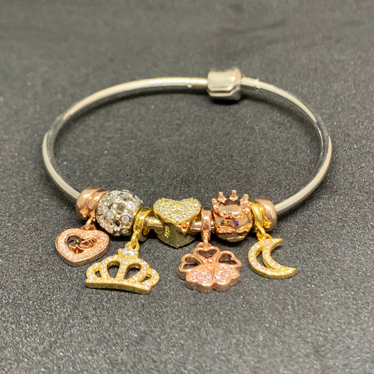 Pandora bangle with crown, heart, moon charms