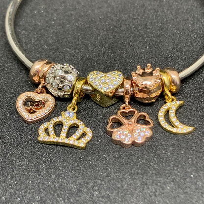 Pandora bangle with crown, heart, moon charms