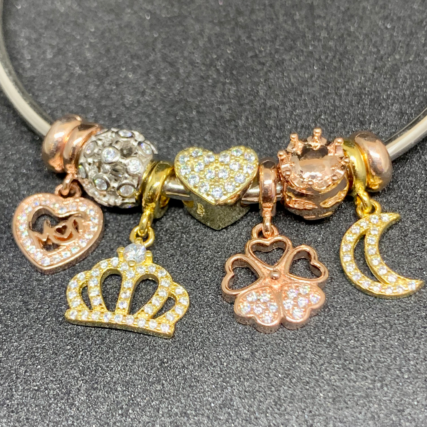 Pandora bangle with crown, heart, moon charms